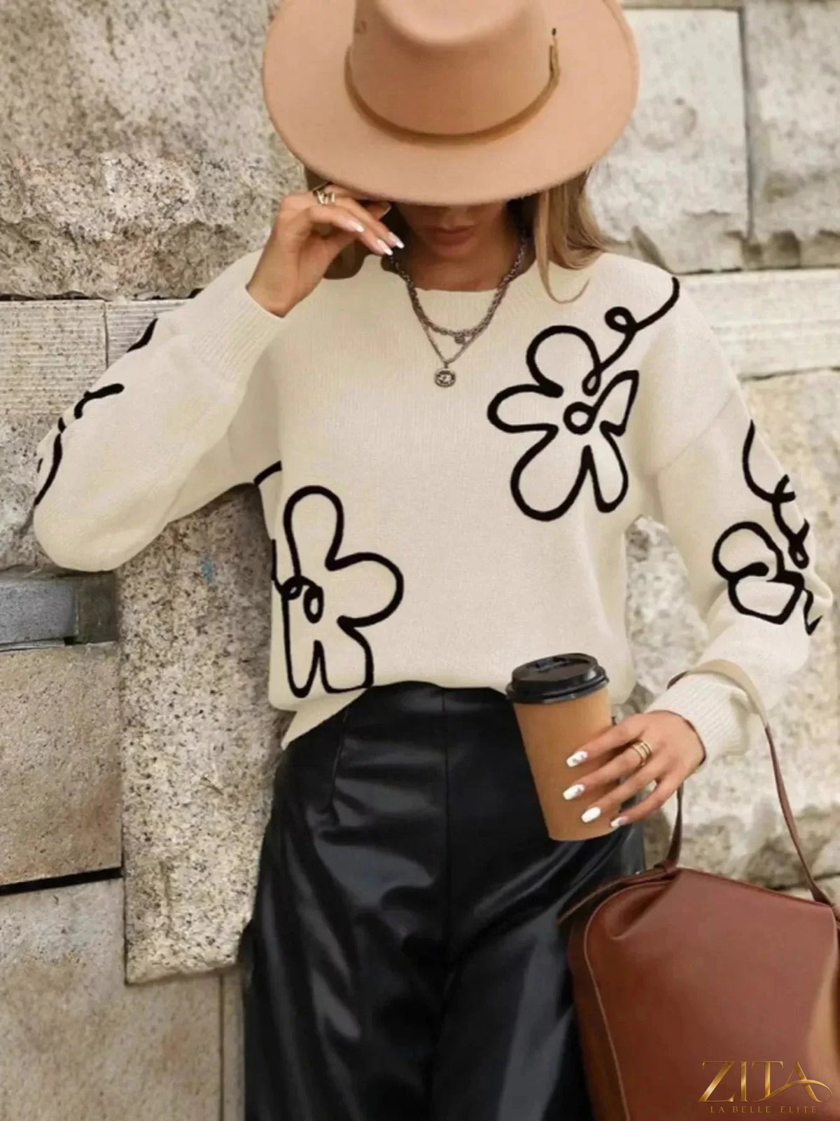 Flower dropped shoulder sweater by Trendsi featuring a cozy knit design and floral pattern on a soft, casual sweater.