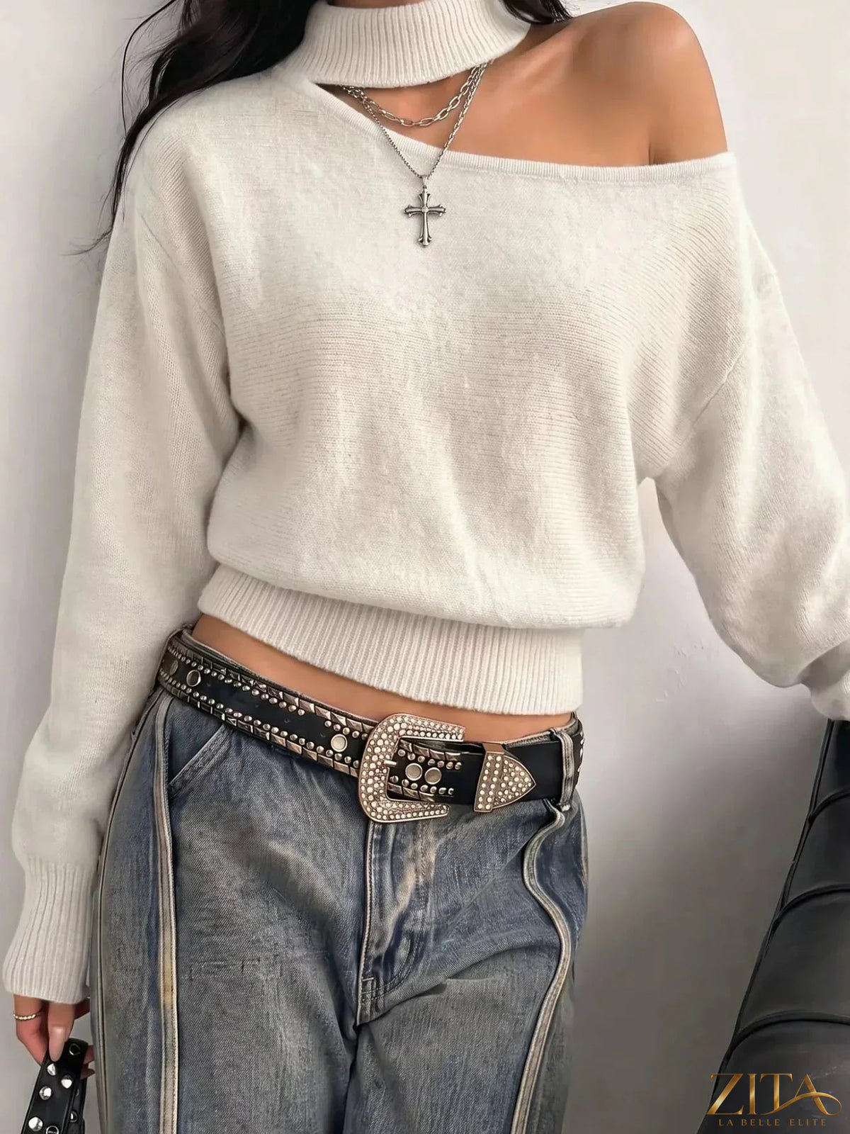 Cold-shoulder dropped shoulder sweater by Trendsi featuring a cozy knit fabric and stylish cut-out shoulder design.