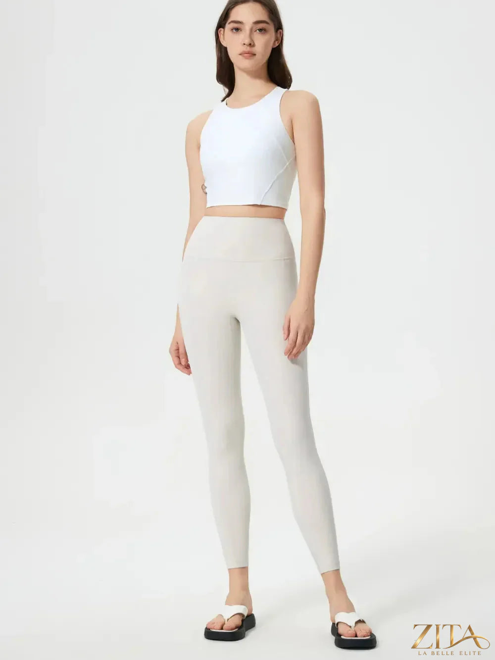 Trendsi Millennia wide waistband active leggings showing a close-up of the black, stretchy fabric and comfortable fit.