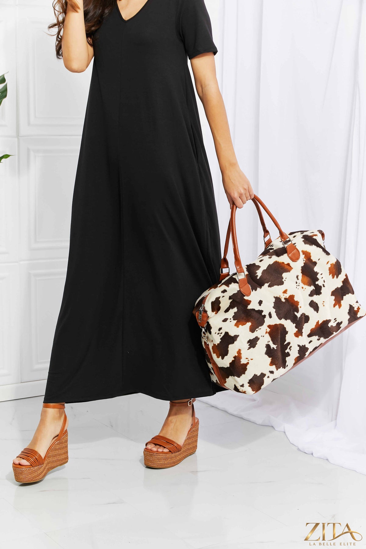Animal print plush weekender bag by Zita La Belle Elite showing a soft, stylish bag with a bold animal pattern and sturdy handles.