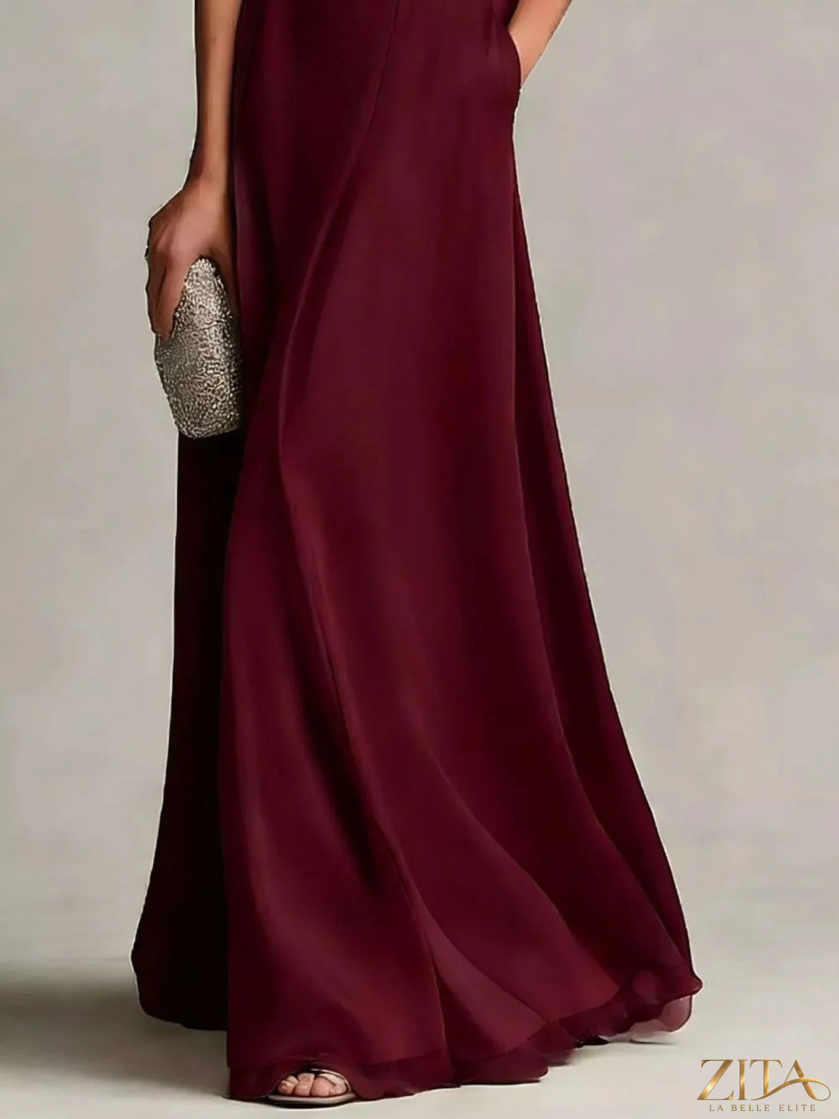 Plus size satin crop top and maxi skirt set by Zita La Belle Elite, featuring a stylish two-piece design in elegant satin fabric.