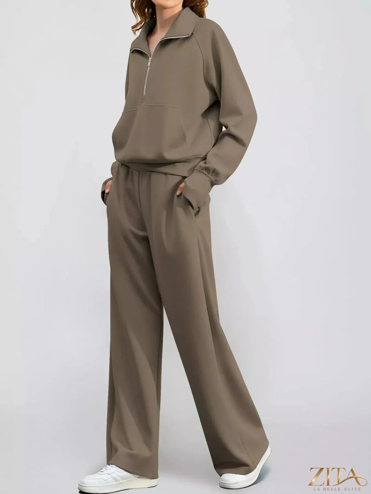 Zita La Belle Elite half-zip sweatshirt and wide-leg pants set in soft fabric, displayed on a hanger against a neutral background.