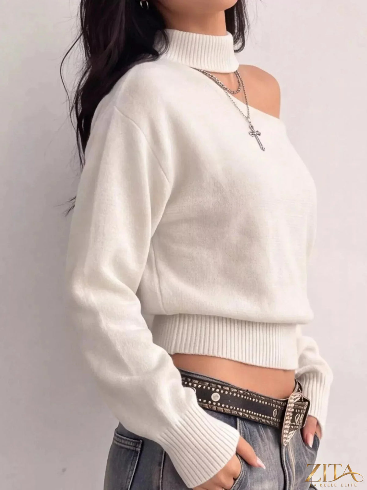 Cold-shoulder dropped shoulder sweater by Trendsi, featuring a cozy knit design with cut-out shoulder details and relaxed fit.