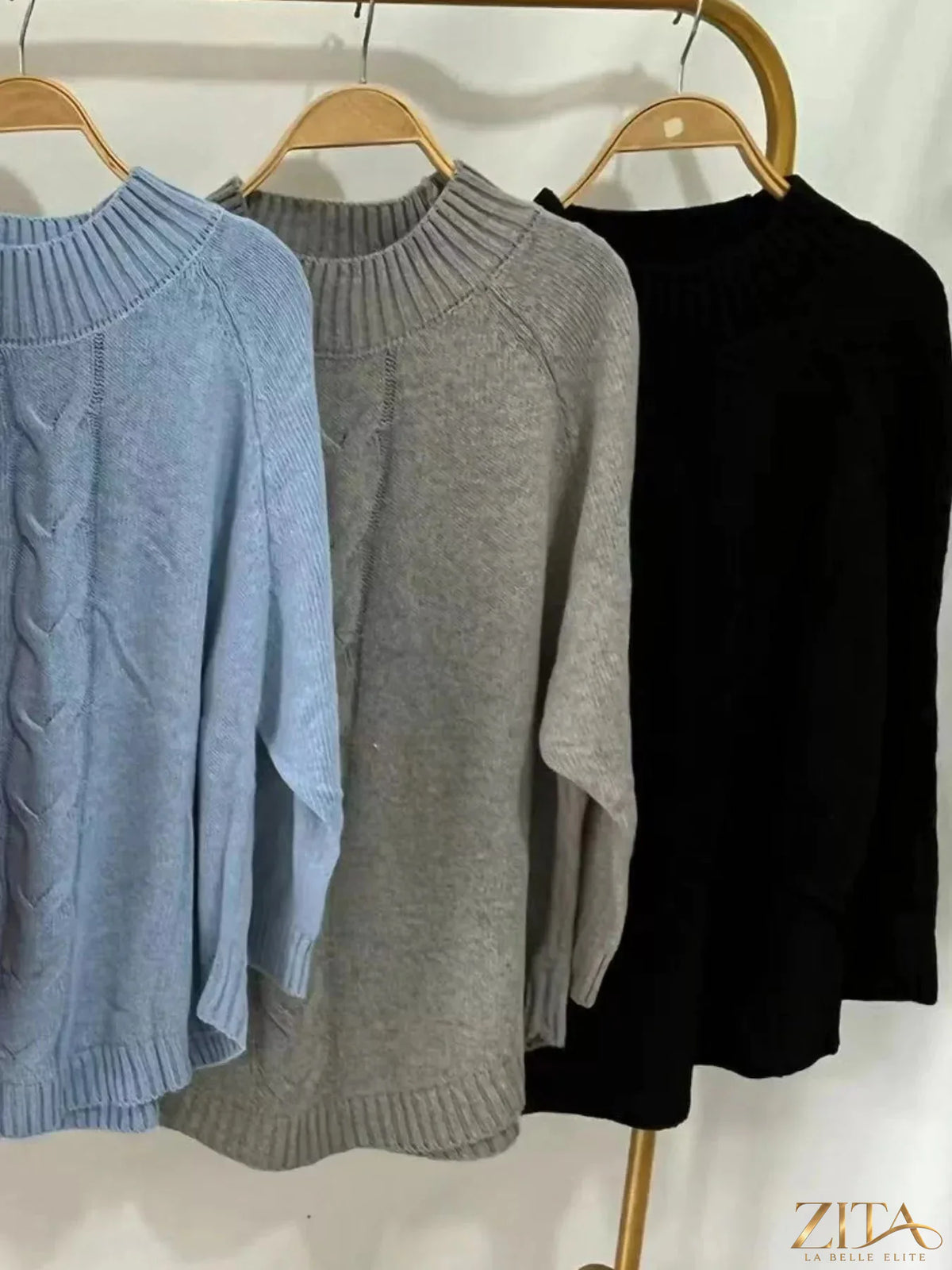 Zita La Belle Elite cable-knit long sleeve sweater in a cozy, textured knit fabric, displayed on a neutral background.