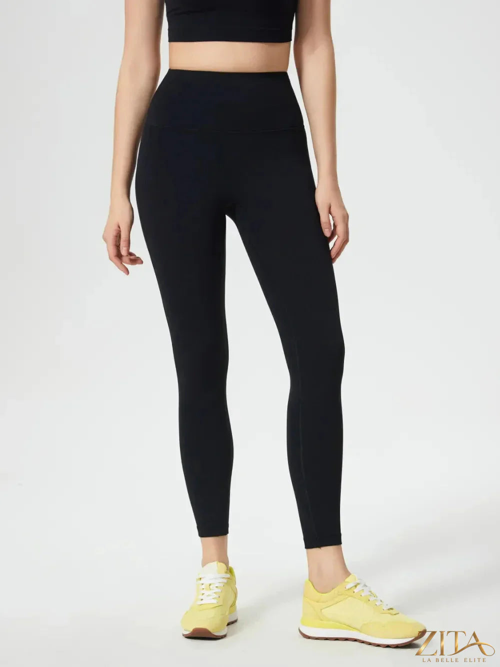 Millennia wide waistband active leggings by Trendsi, designed for comfort and flexibility, shown in black fabric with seamless fit.