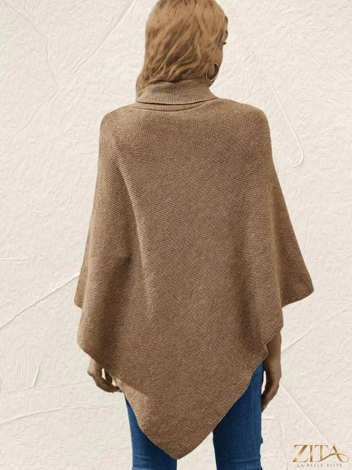 Zita La Belle Elite button-decor turtleneck poncho pullover in cozy knit fabric, featuring decorative buttons on the front.