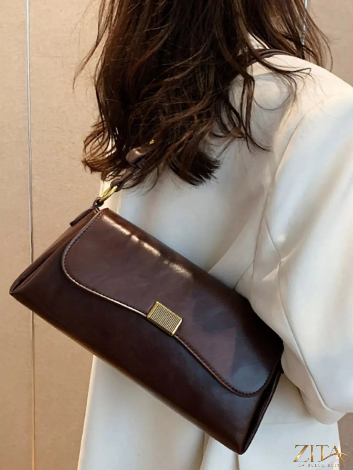 Leather flap shoulder bag from Trendsi featuring a sleek design, adjustable strap, and durable leather material.