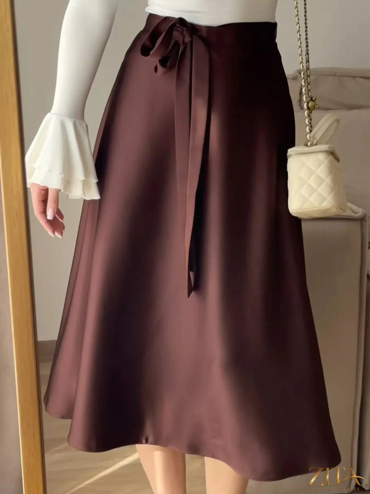 Satin A-Line midi skirt from Trendsi featuring a smooth, shiny fabric and a flattering A-line silhouette for elegant style.