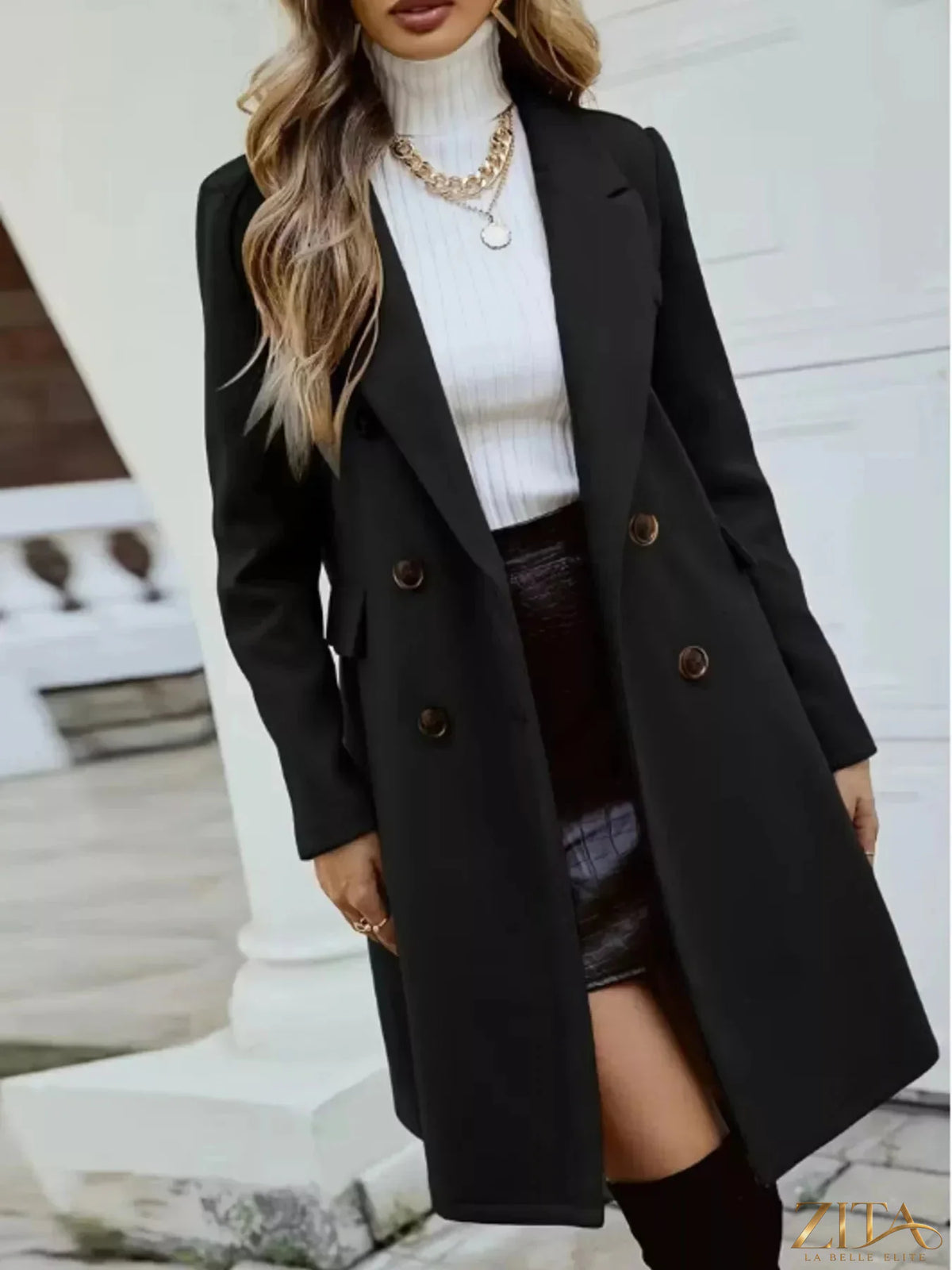 Zita La Belle Elite double-breasted longline coat in neutral fabric, featuring lapel collar and tailored fit, displayed on a mannequin.