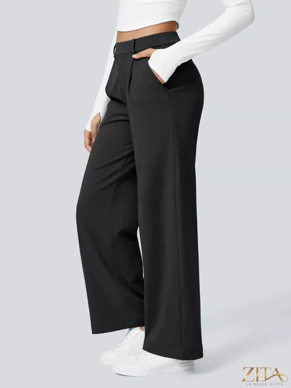 Zita La Belle Elite wide leg pants in neutral fabric, featuring a relaxed fit and high waist, styled with a casual top.