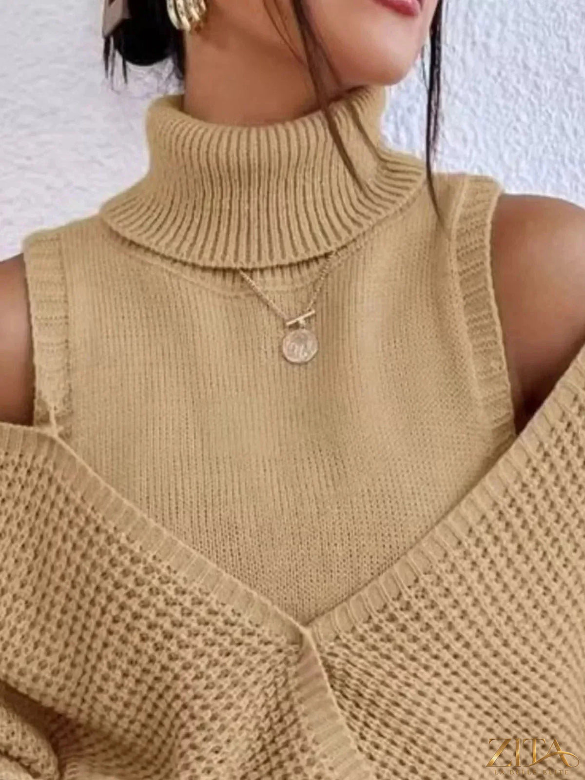 Waffle knit cold shoulder turtleneck sweater by Trendsi, featuring a cozy design with shoulder cutouts and a high neckline.