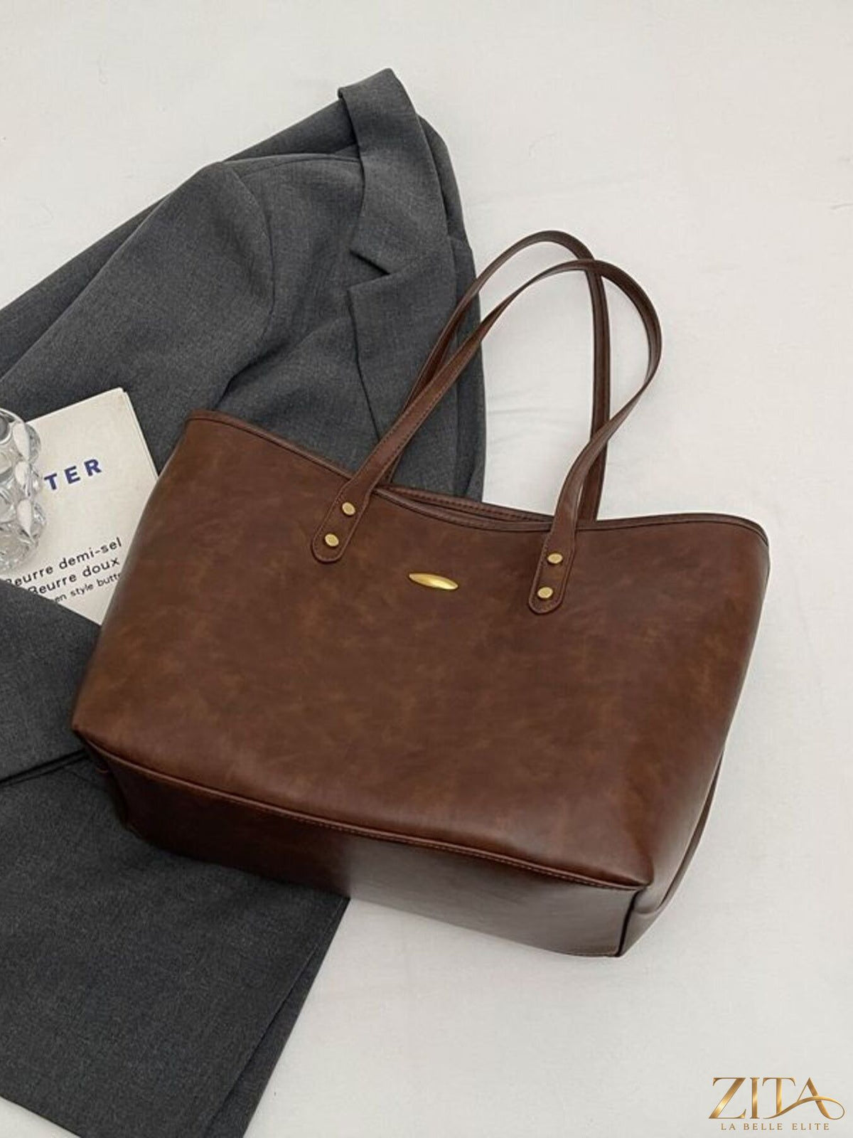 Vintage leather tote bag by Zita La Belle Elite, featuring a classic design with sturdy handles and a spacious interior.