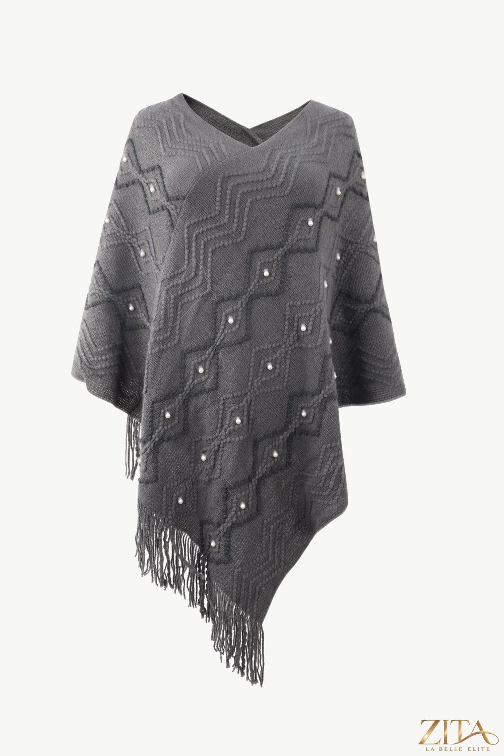 Pearl trim V-neck fringe hem poncho by Trendsi, showcasing a stylish knit poncho with elegant pearl details and flowing fringe.