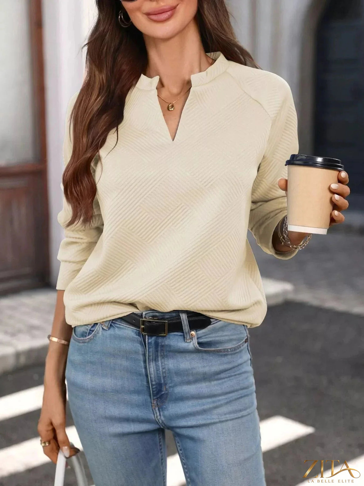 Zita La Belle Elite textured notched long sleeve sweatshirt featuring a stylish design and comfortable fabric in the image.