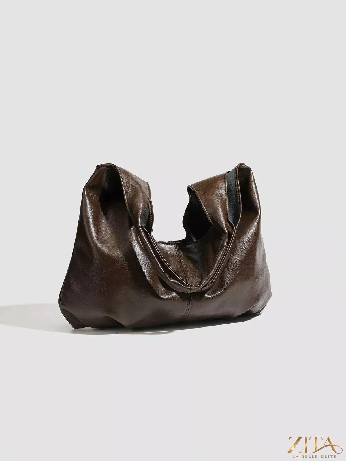Vintage glossy hobo shoulder bag with matching pouch by Zita La Belle Elite, featuring a sleek design and polished finish.