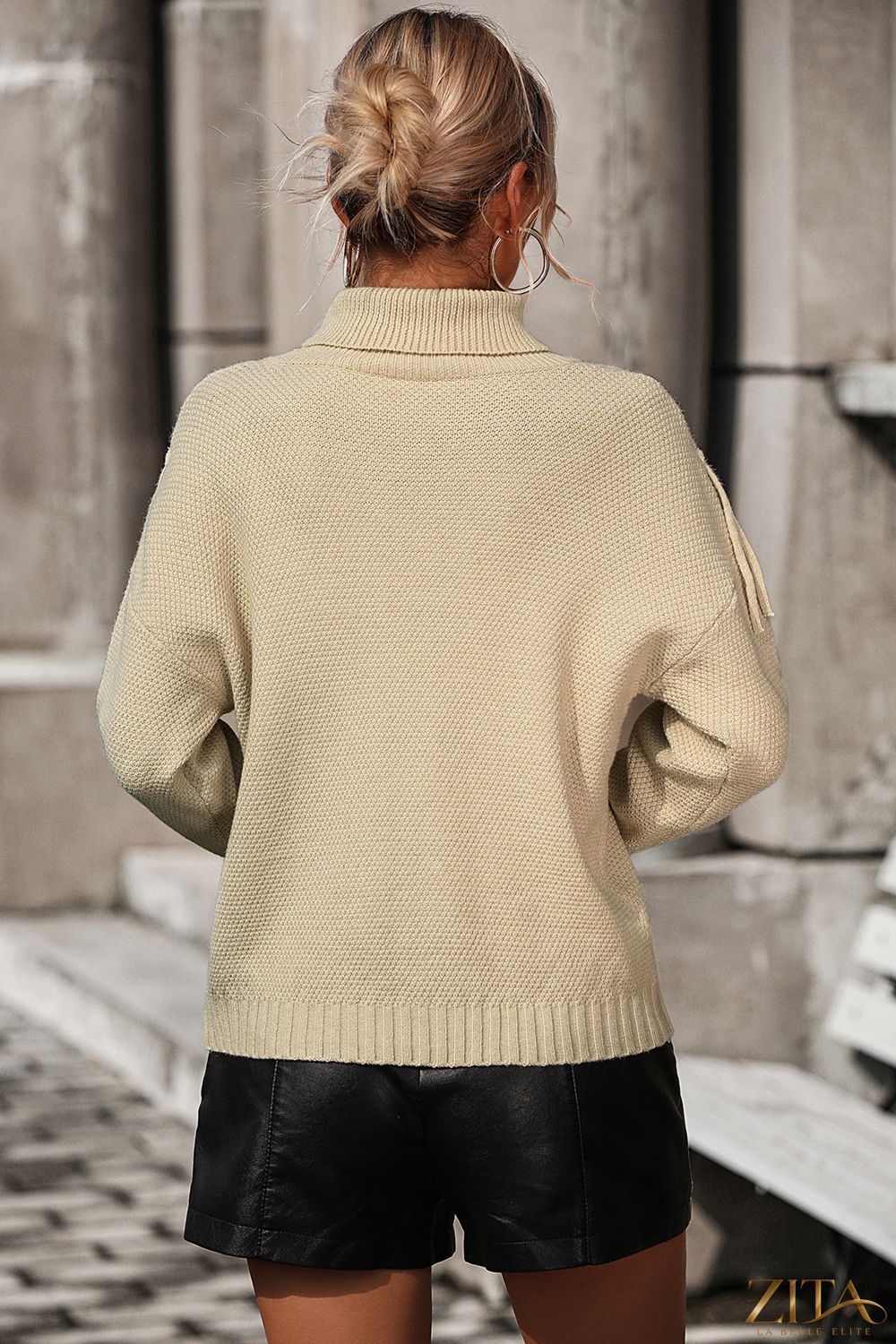 Turtle neck tassel front long sleeve pullover sweater by Trendsi, featuring a cozy fit and stylish tassel accents.
