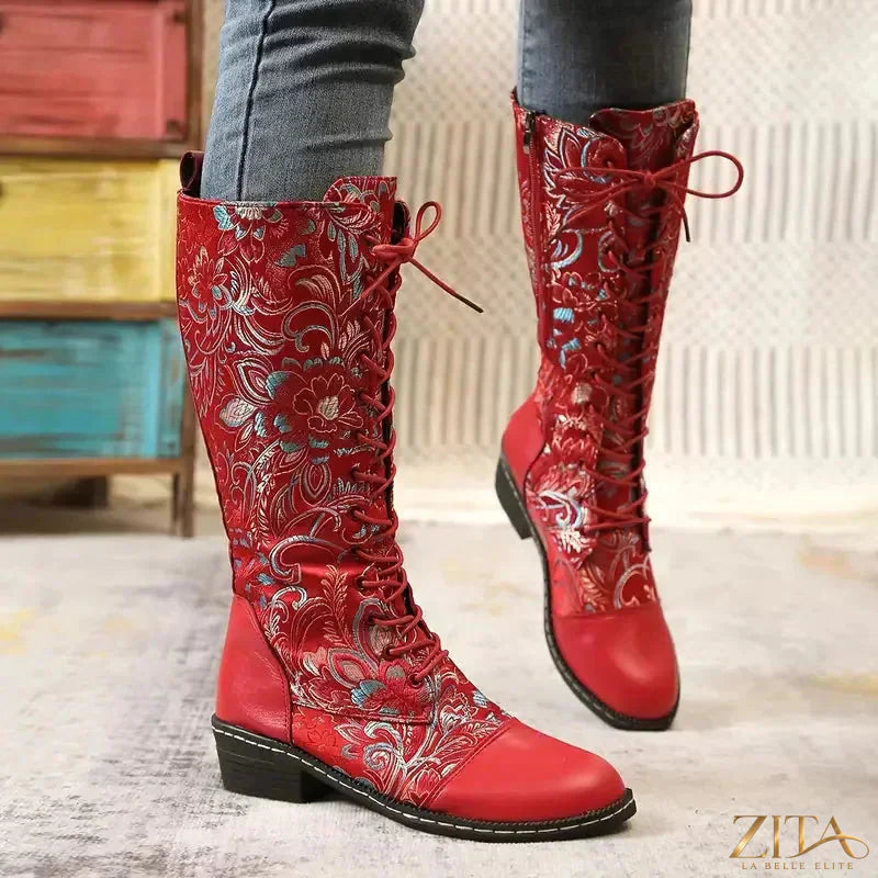Embroidered lace-up knee-high boots by Zita La Belle Elite featuring detailed embroidery and sleek leather construction.