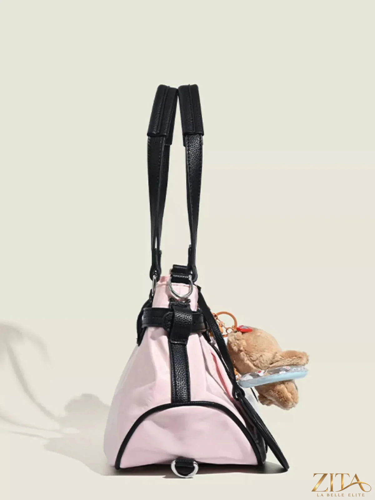 Contrast lightweight shoulder bag by Zita La Belle Elite with sleek design and adjustable strap, shown in black and white tones.