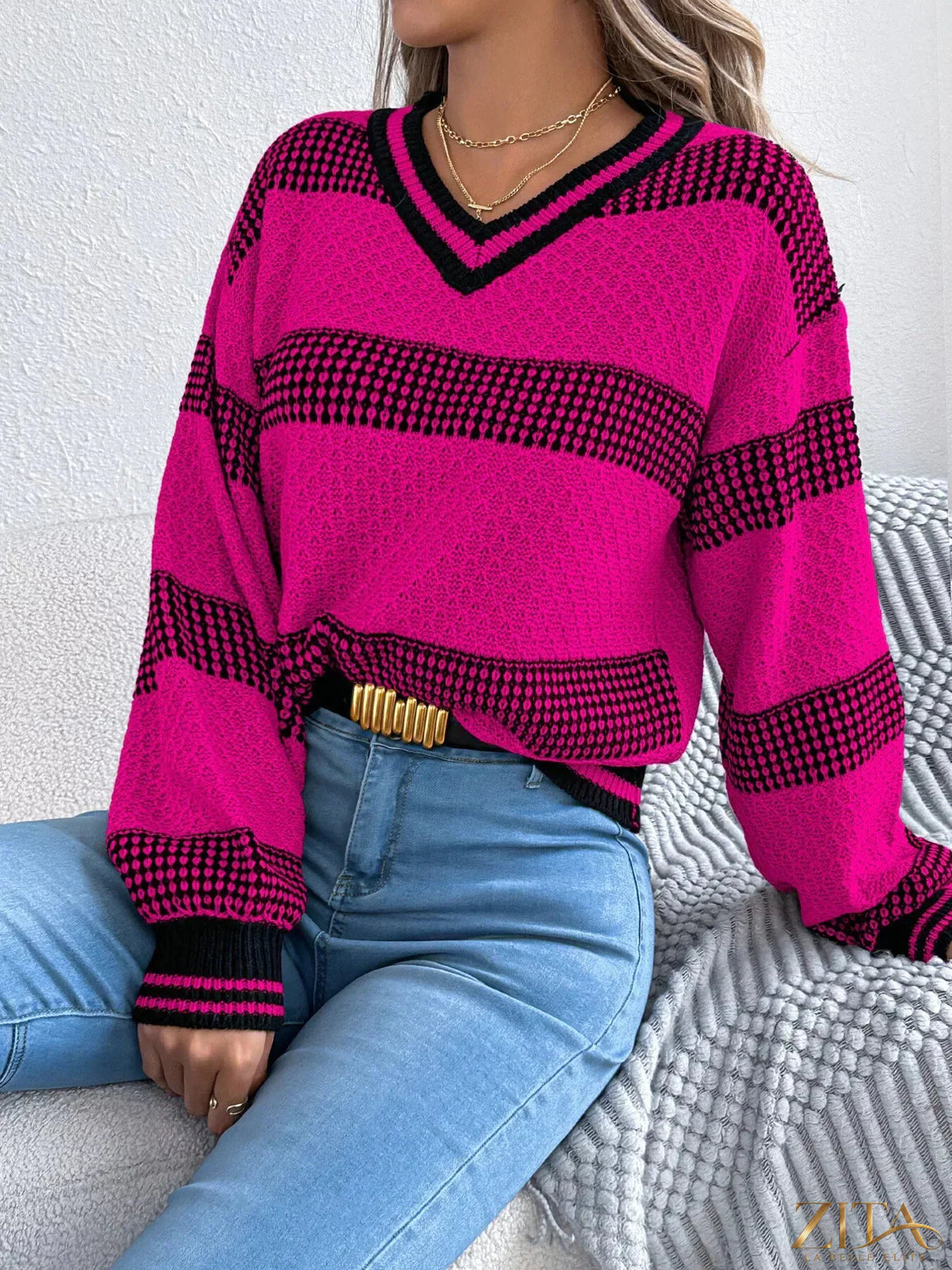 Contrast striped V-neck sweater by Trendsi featuring bold horizontal stripes and a classic V-neck design.
