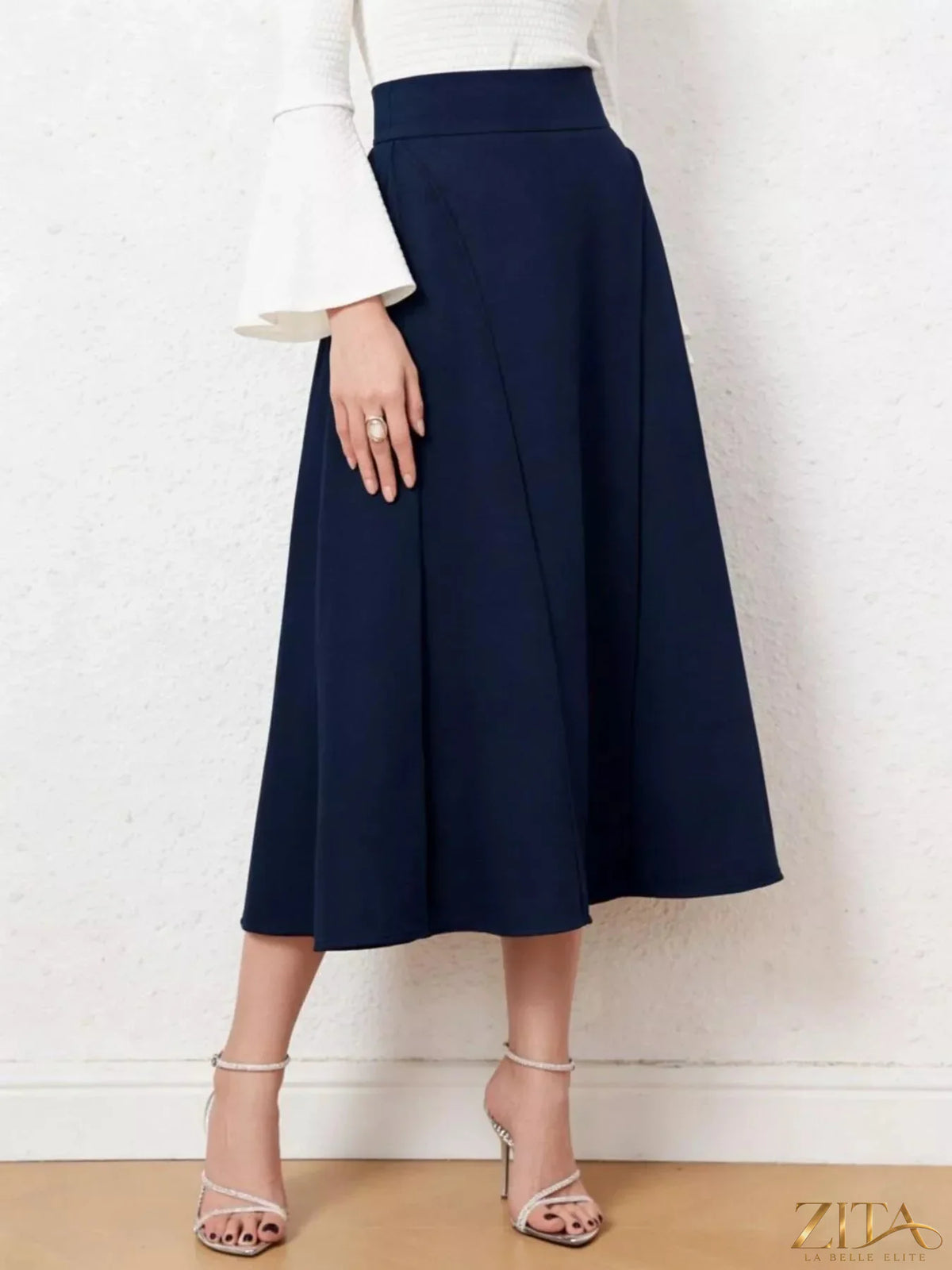 Trendsi A-Line midi skirt in soft fabric, featuring a high waist and flowing silhouette, perfect for casual or dressy occasions.
