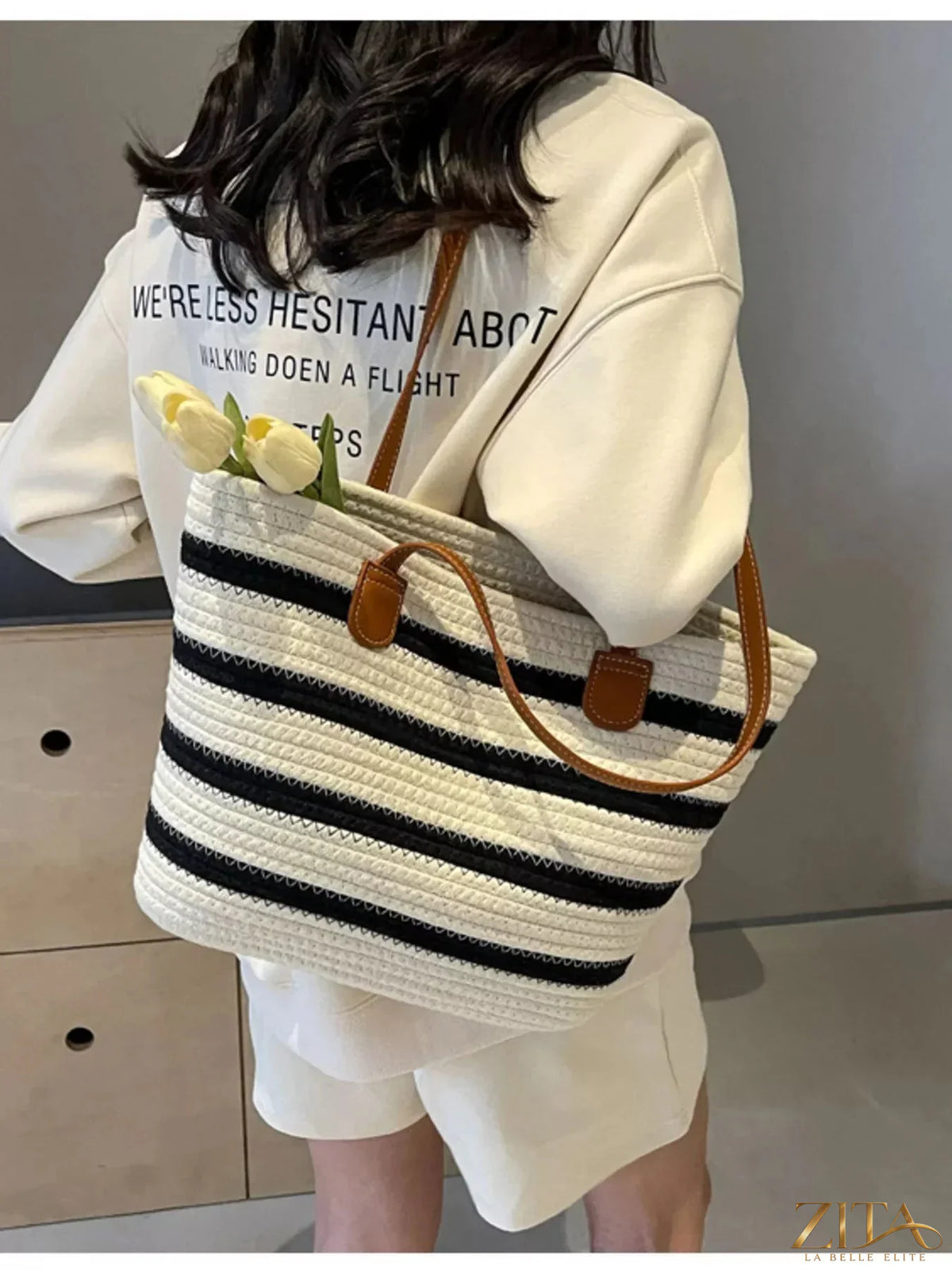 Zita La Belle Elite striped straw tote bag with woven handles and colorful horizontal stripes for summer beach or casual outings.