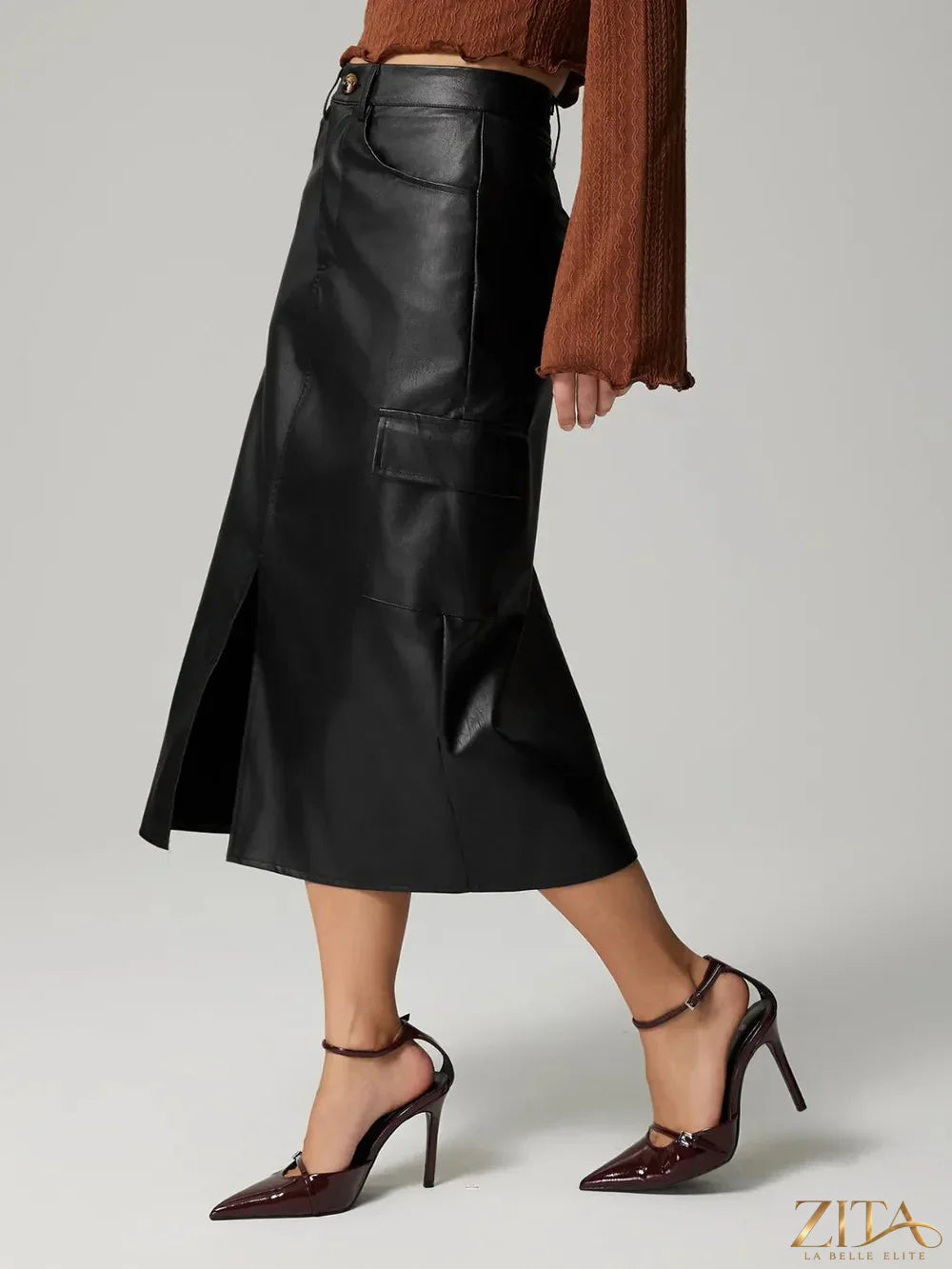Black slit midi skirt with pockets from Trendsi, featuring a flowy design and side slit detail.