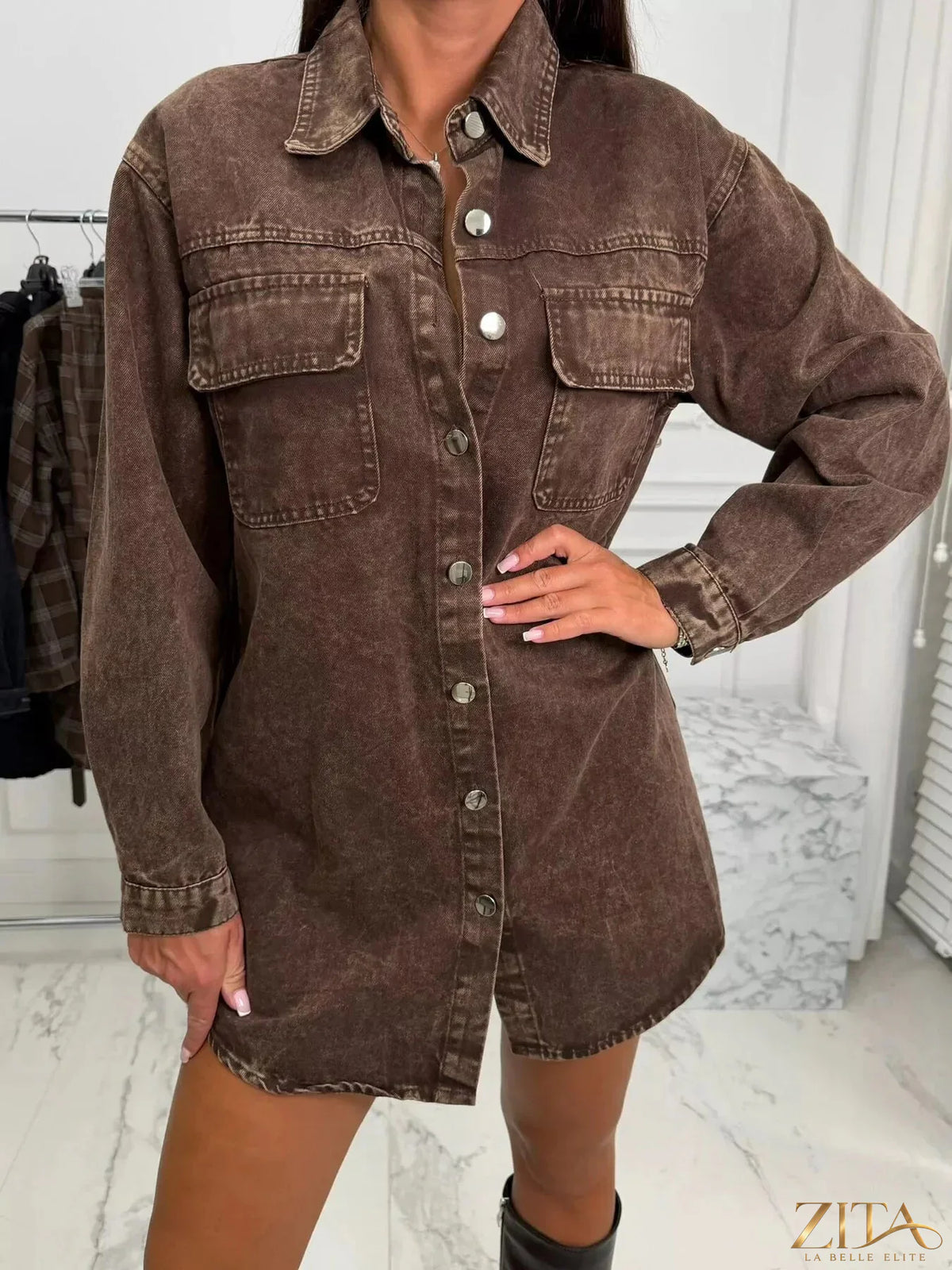 Vintage washed denim jacket with chest pockets by Zita La Belle Elite, featuring classic style and faded blue denim fabric.
