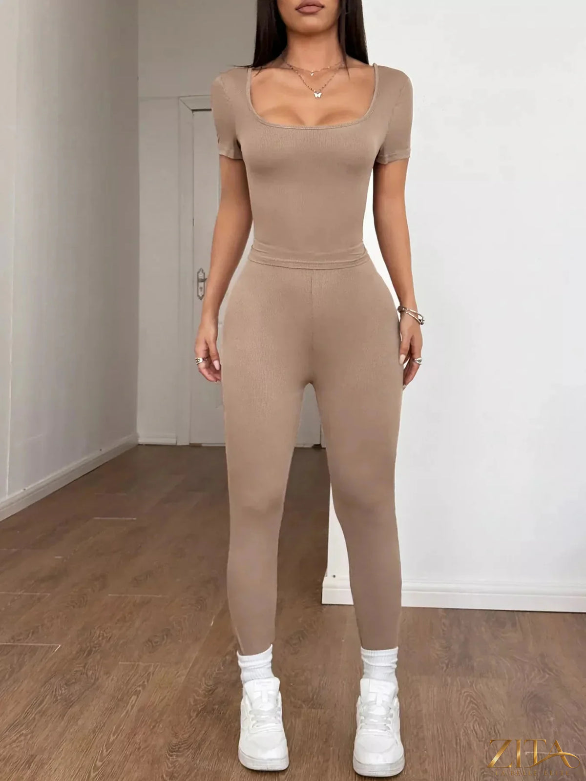 Trendsi short sleeve top and matching leggings set in a coordinated fabric, stylish and comfortable for casual wear.