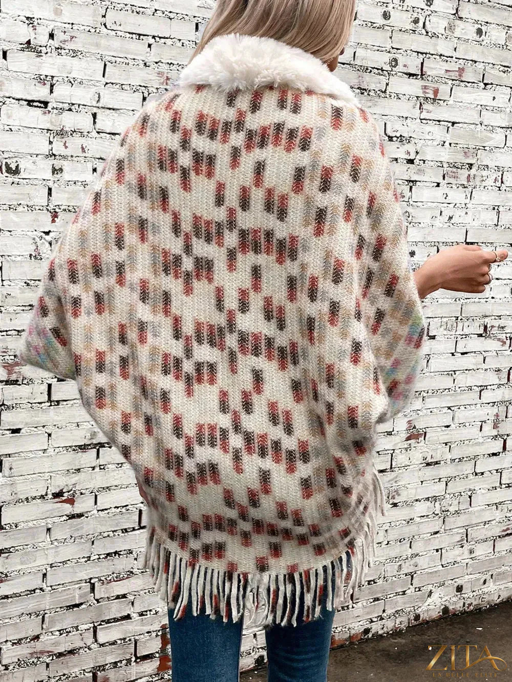 Fuzzy open front fringe poncho by Trendsi featuring soft texture, fringe details, and cozy open style for fall and winter wear.