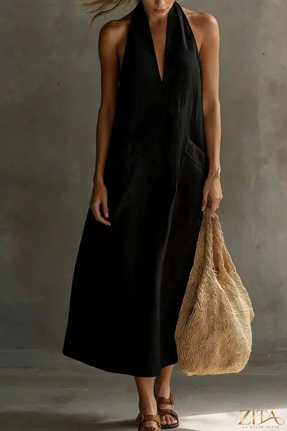 Casual Zita La Belle Elite halter neck midi dress with pockets, sleeveless design, flowing fabric, perfect for summer wear.