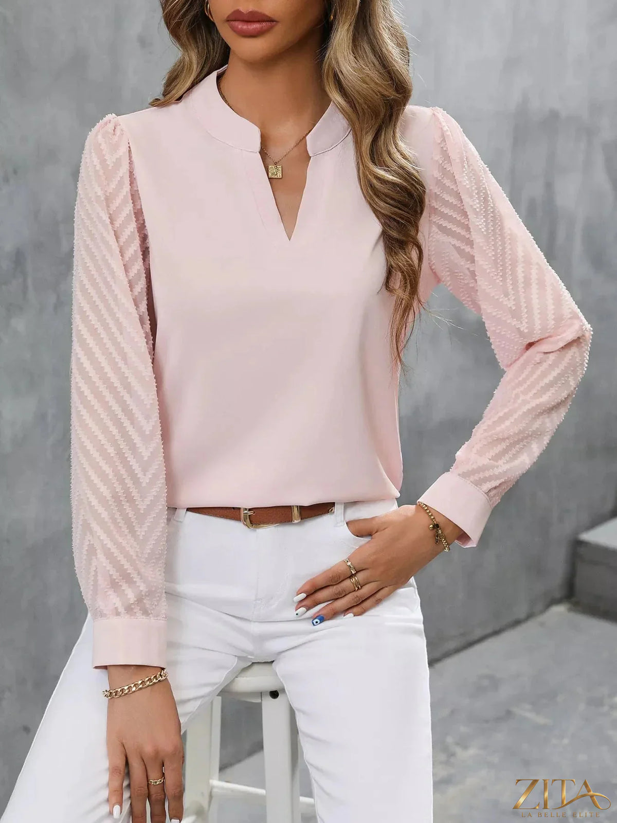 Zita La Belle Elite sheer sleeve v-neck blouse with lightweight fabric and elegant design, shown on a model.