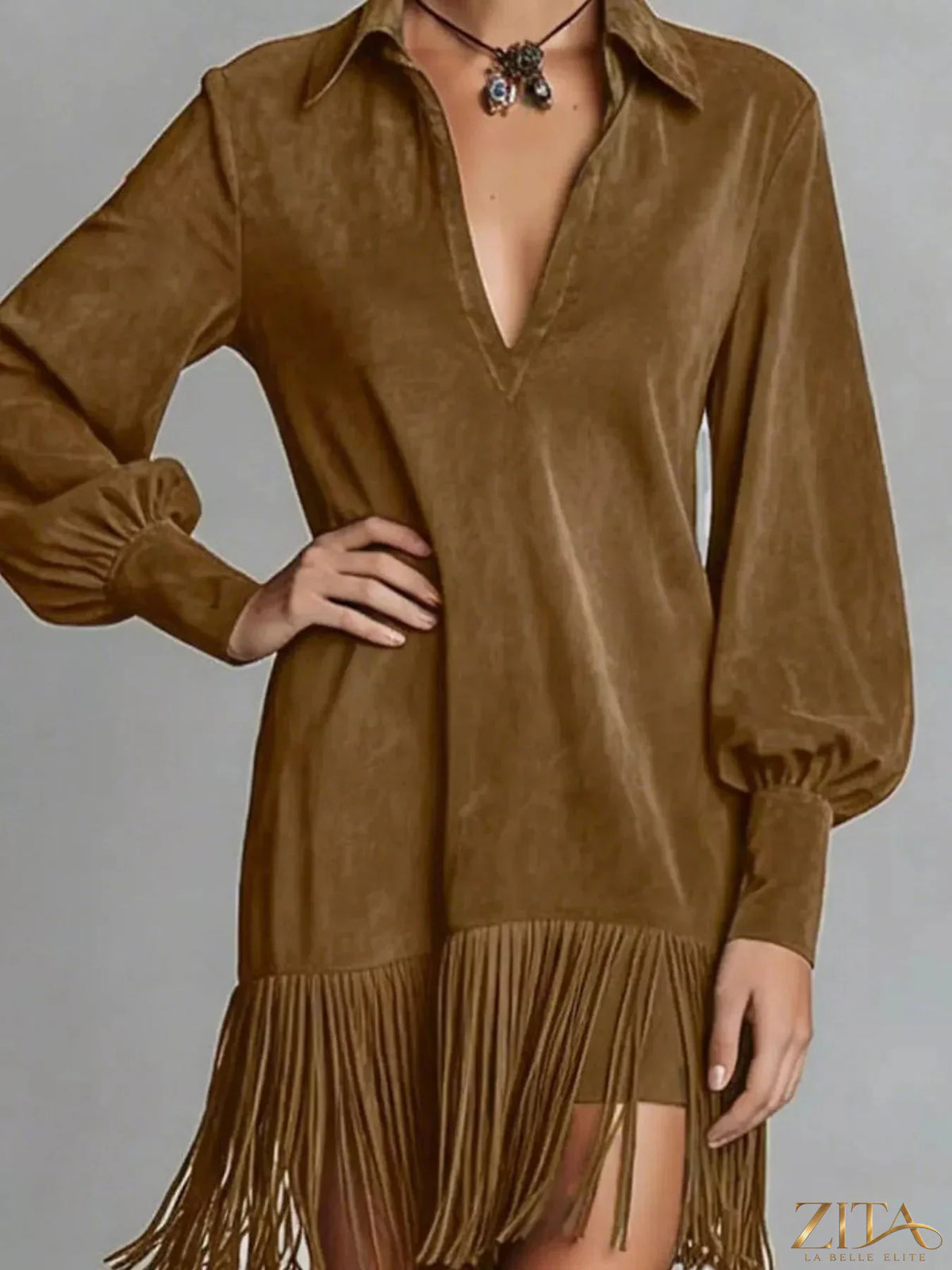 Max-Origin fringed lantern sleeve dress by Trendsi featuring a flowing silhouette and eye-catching fringe details.