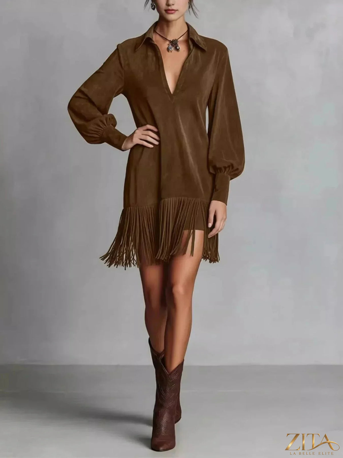 Trendsi fringed lantern sleeve dress featuring flowing fabric and decorative fringe detail, stylish for casual or dressy occasions.