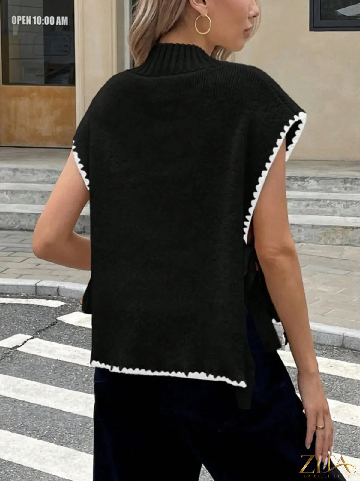 Ribbed turtleneck sweater vest with contrast trim from Trendsi, showing the textured fabric and stylish neckline detail.