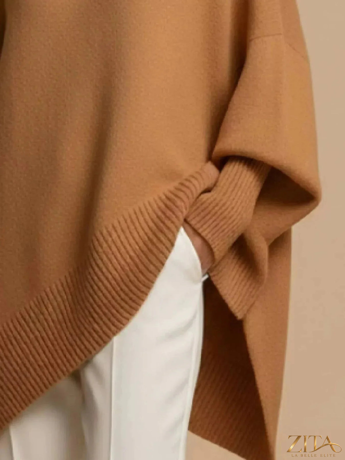 Oversized dropped shoulder sweater by Trendsi, soft knit fabric, relaxed fit, featuring a cozy, casual style ideal for layering.