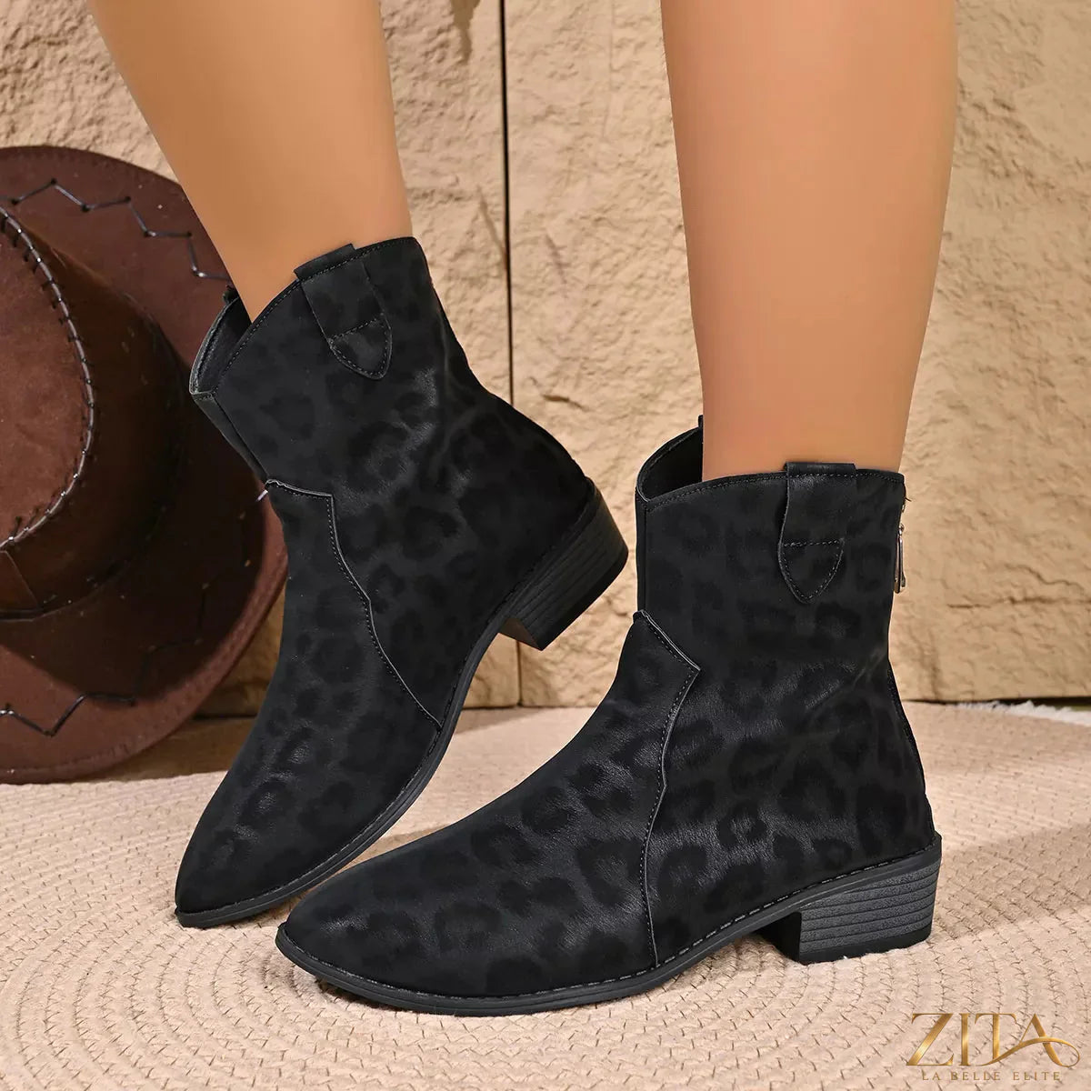 Leopard print Western ankle boots from Trendsi with pointed toe and stacked heel, showcasing bold animal print design.