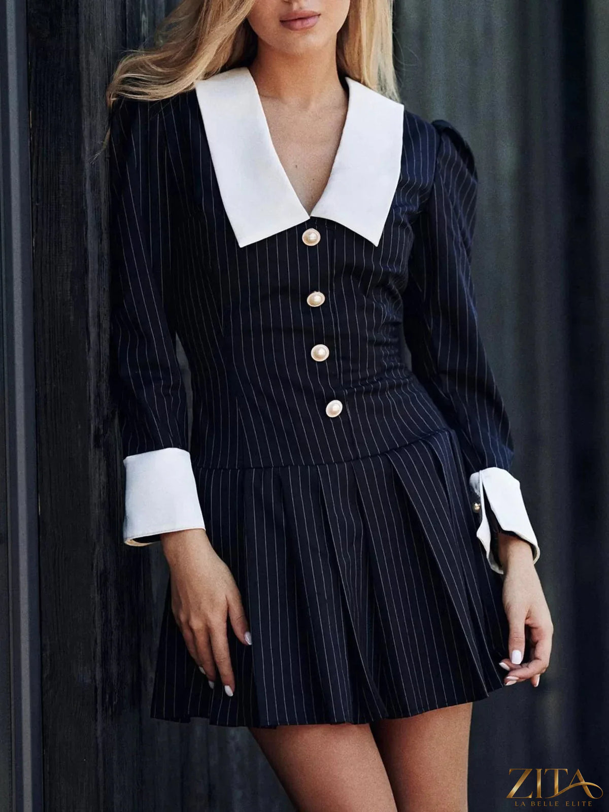 Zita La Belle Elite striped long-sleeve pleated mini dress with a fitted silhouette and stylish design, shown in the image.