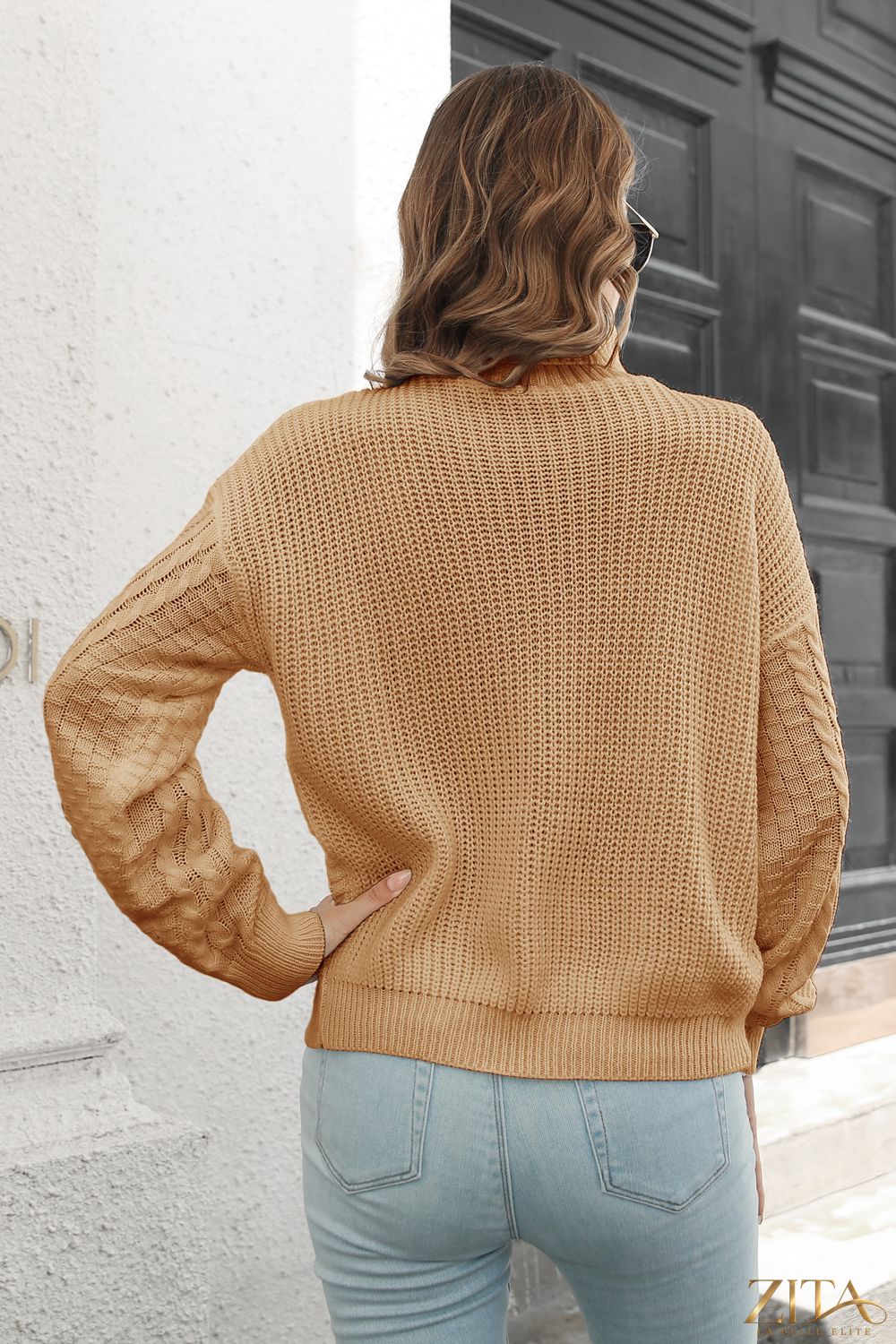 Zita La Belle Elite cable-knit turtleneck sweater in cozy, textured fabric, featuring a high neckline and classic design.