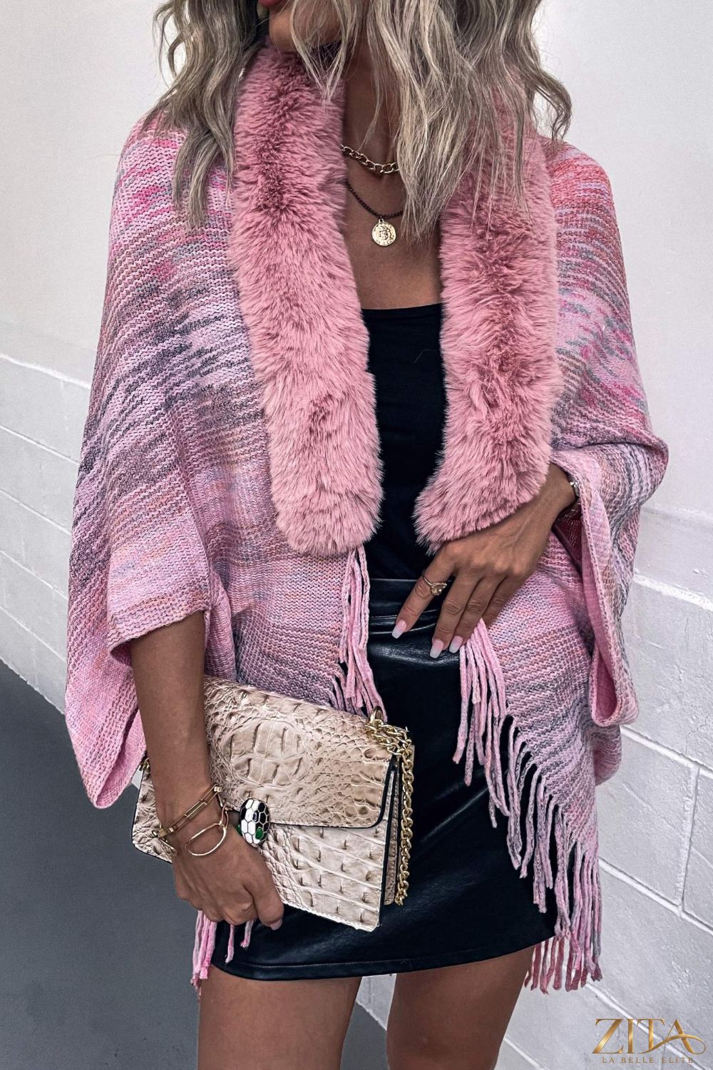 Open front fringe hem poncho by Trendsi, featuring a flowing design with fringe details and a cozy, stylish fit.