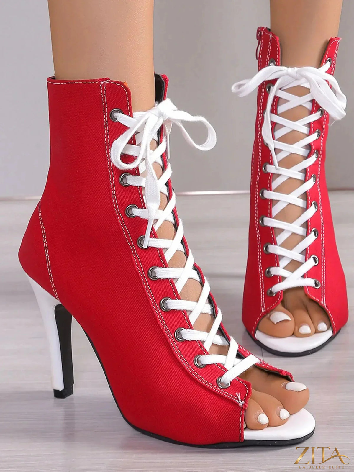 Zita La Belle Elite canvas lace-up peep toe stiletto ankle boots showing beige fabric and lace-up front with heel detail.