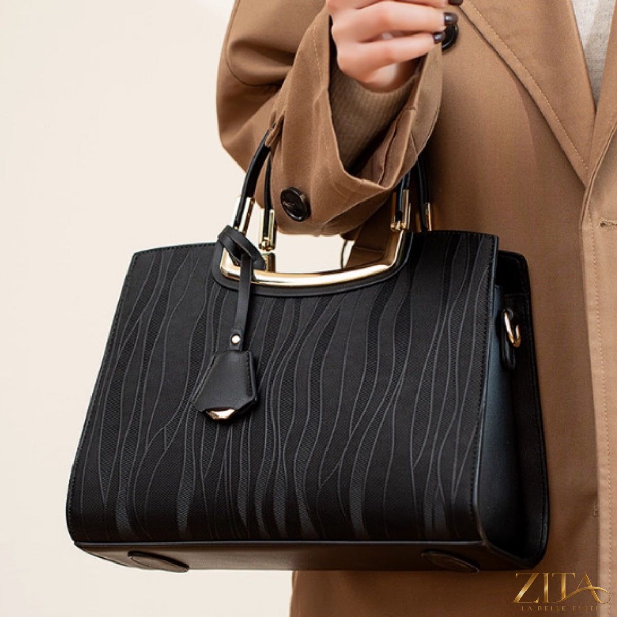 Crocodile embossed leather top handle handbag by Zita La Belle Elite with gold hardware and structured design.