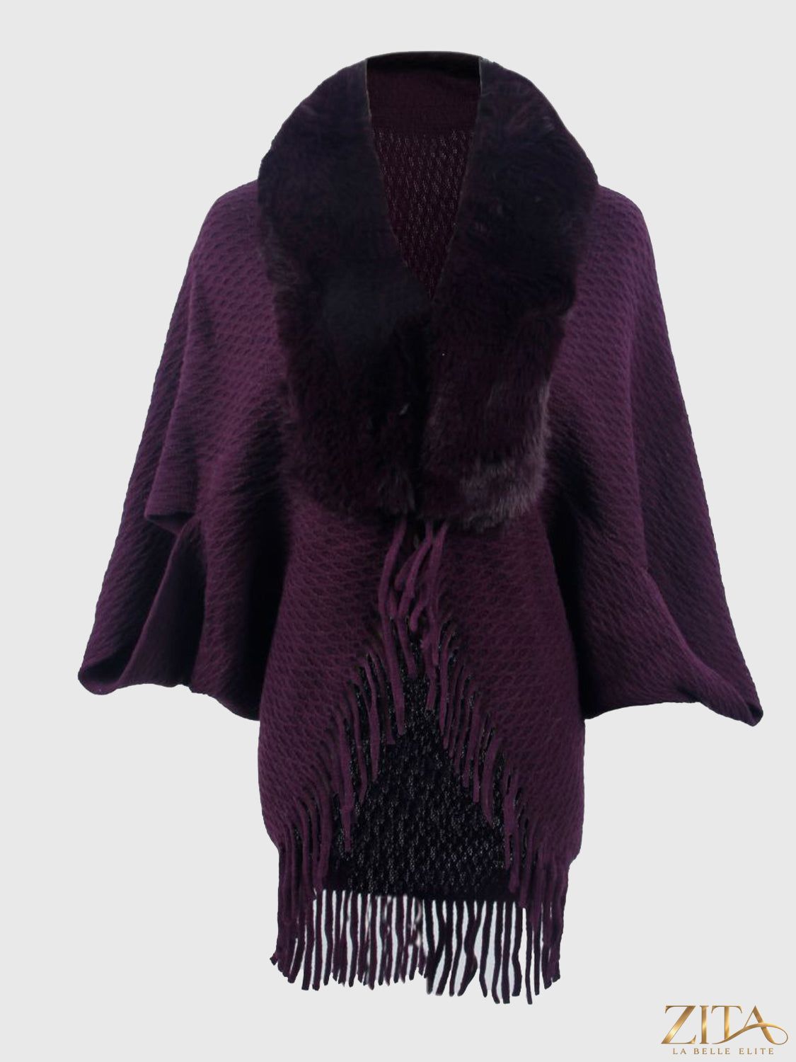 Open front fringe hem poncho from Trendsi, featuring lightweight fabric and stylish fringe detailing at the hem.