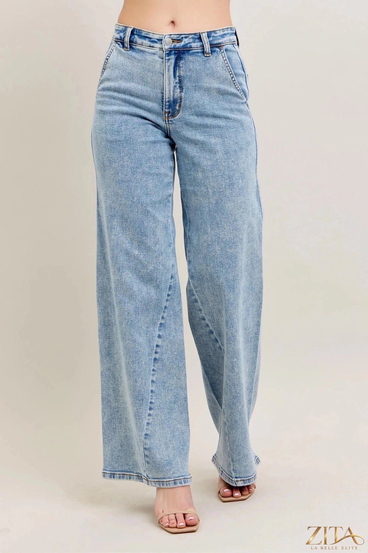 Zita La Belle Elite Judy Blue high waist wide leg jeans with skewed inseam and relaxed fit, displayed on a hanger.