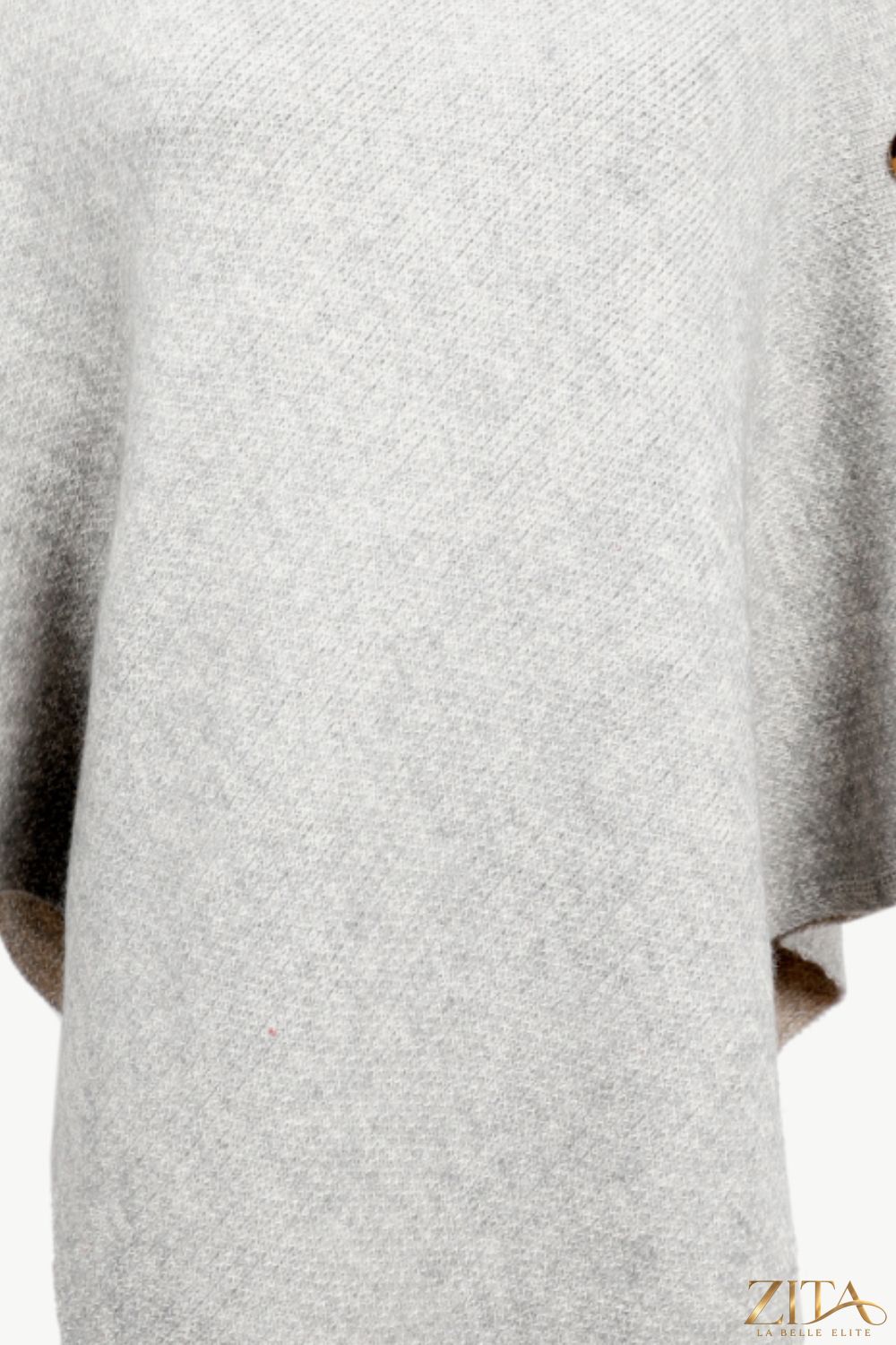 Zita La Belle Elite turtleneck buttoned poncho in cozy knit fabric, featuring a high collar and button details for stylish warmth.