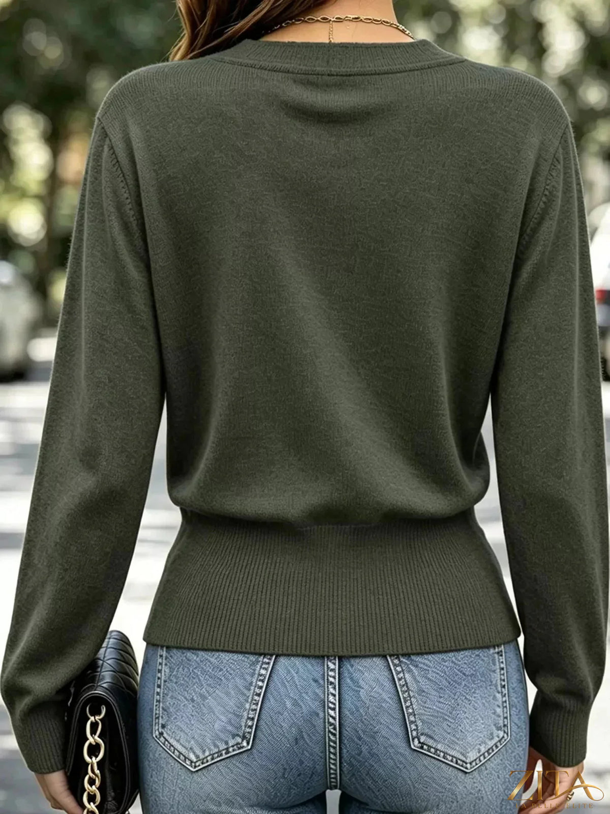 Zita La Belle Elite surplice long sleeve knit top with elastic waist in a stylish, fitted design, shown in a close-up image.