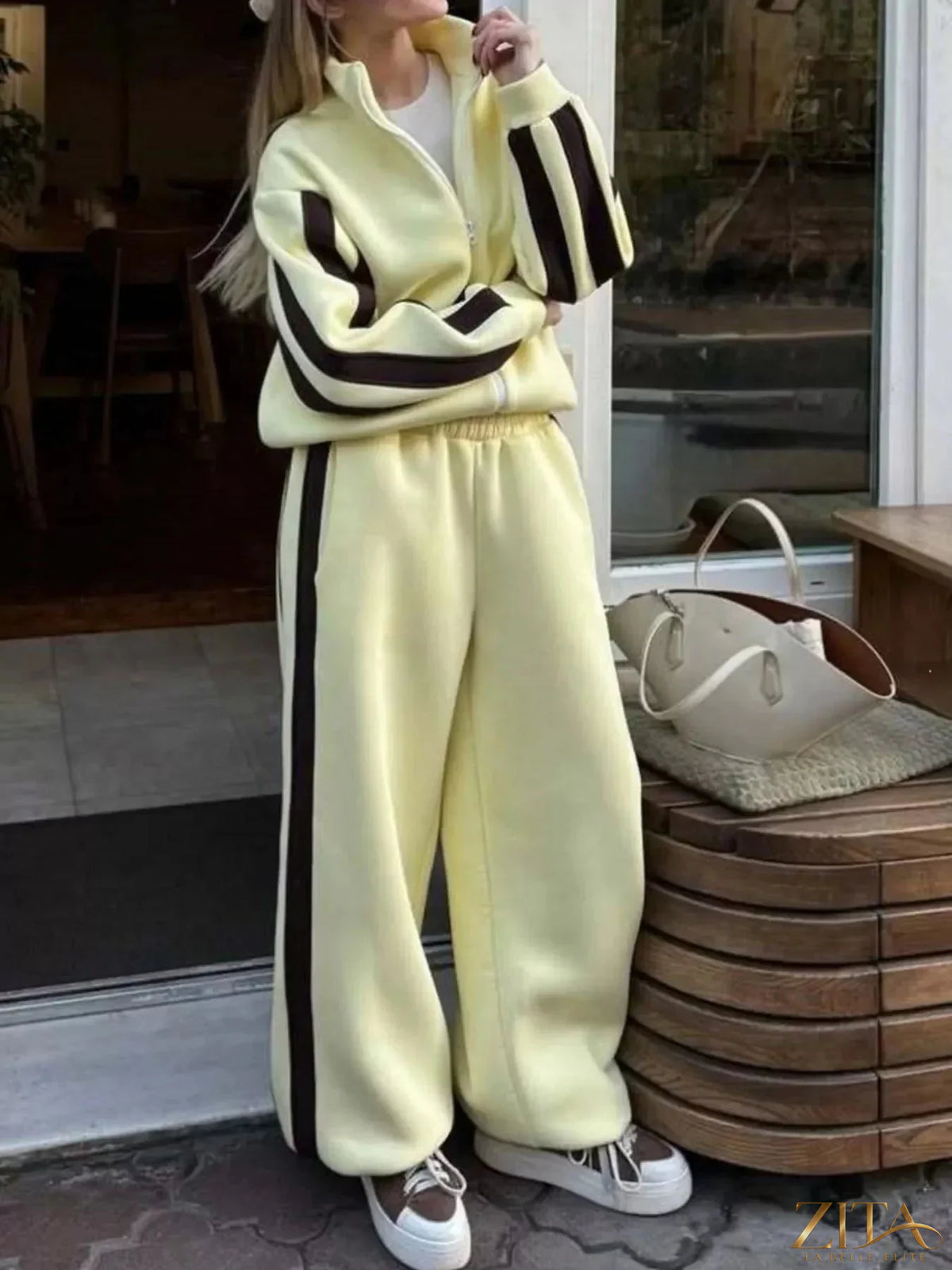 Contrast striped zip-up top and pants set by Zita La Belle Elite, featuring a stylish matching two-piece outfit.