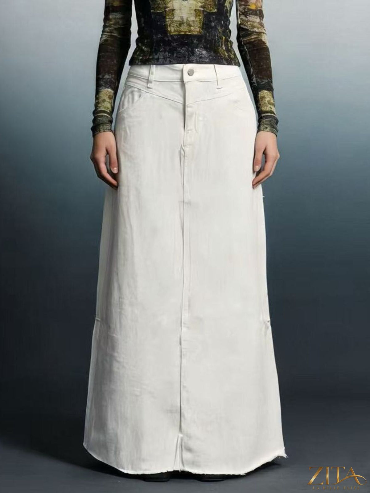 Raw hem maxi denim skirt by Zita La Belle Elite, featuring a flowy silhouette and distressed raw hem detail.