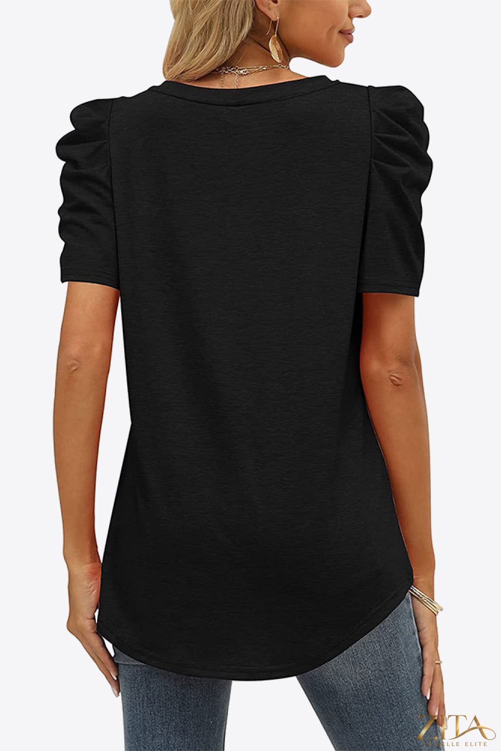 V-neck puff sleeve tee from Trendsi featuring a relaxed fit, soft fabric, and stylish puffed sleeves in a casual design.