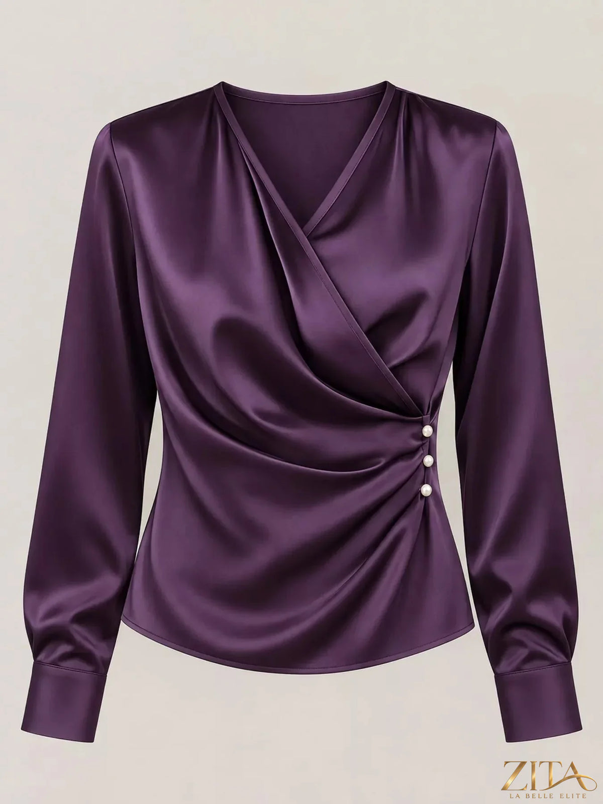 Zita La Belle Elite satin surplice long sleeve blouse with elegant draped design and deep V neckline on a model.