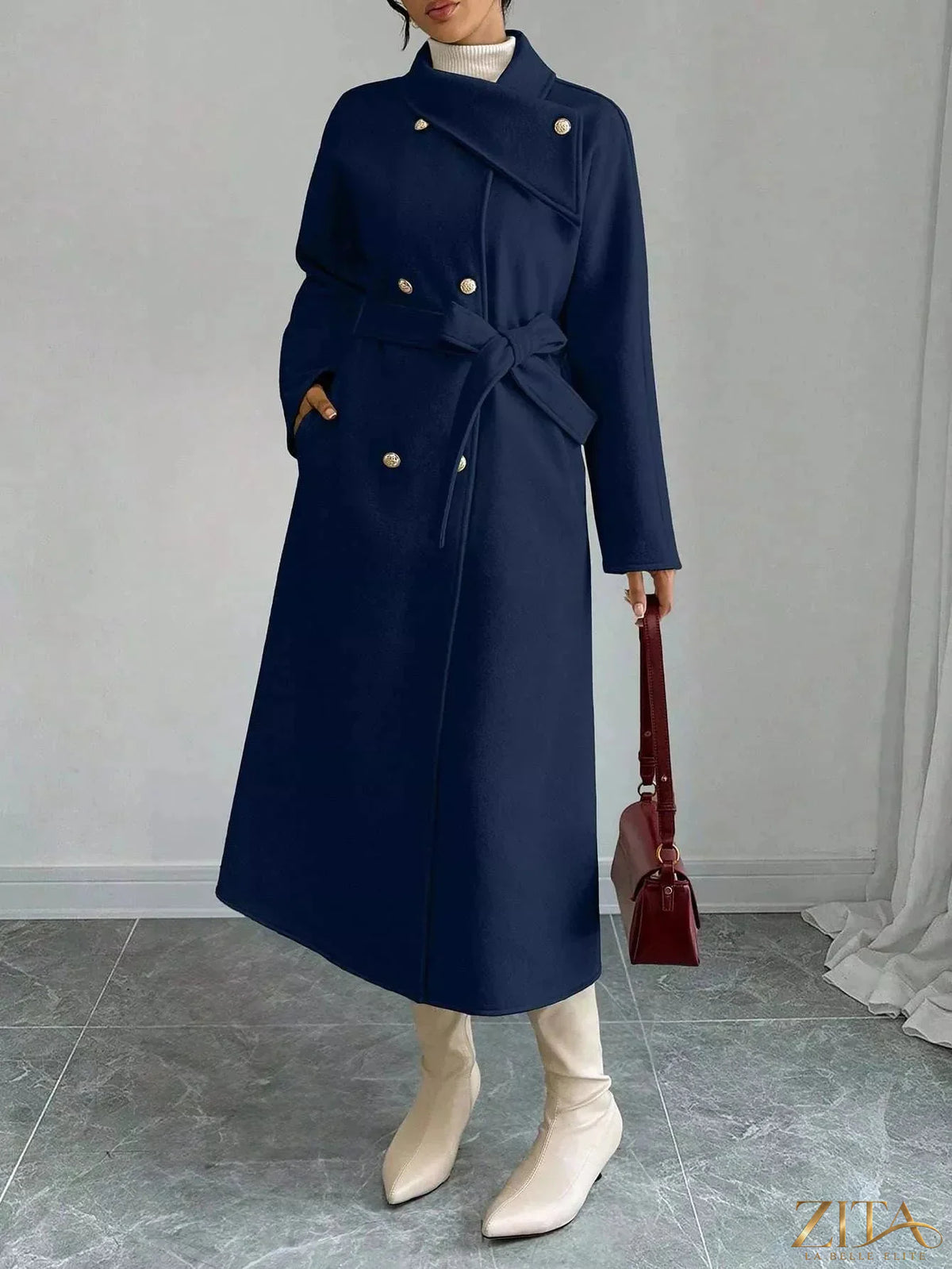 Zita La Belle Elite double-breasted longline coat with wide lapels and tailored fit, shown in black fabric on a female model.